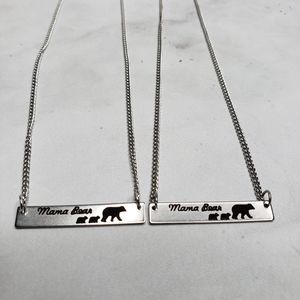 Mama bear silver colored necklace